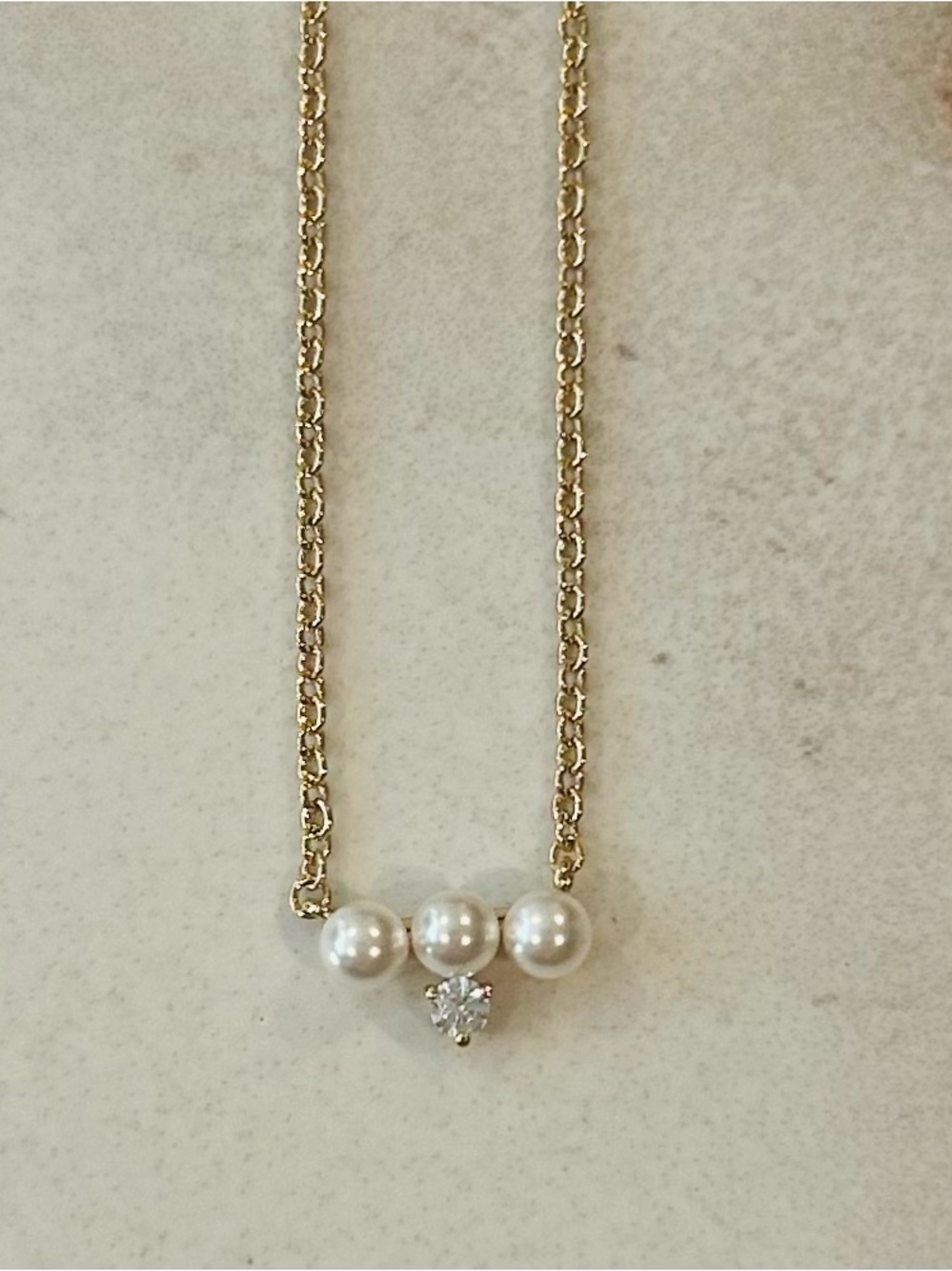 Elegant AJOA Gold Toned Faux Pearl Necklace with Accent Stone